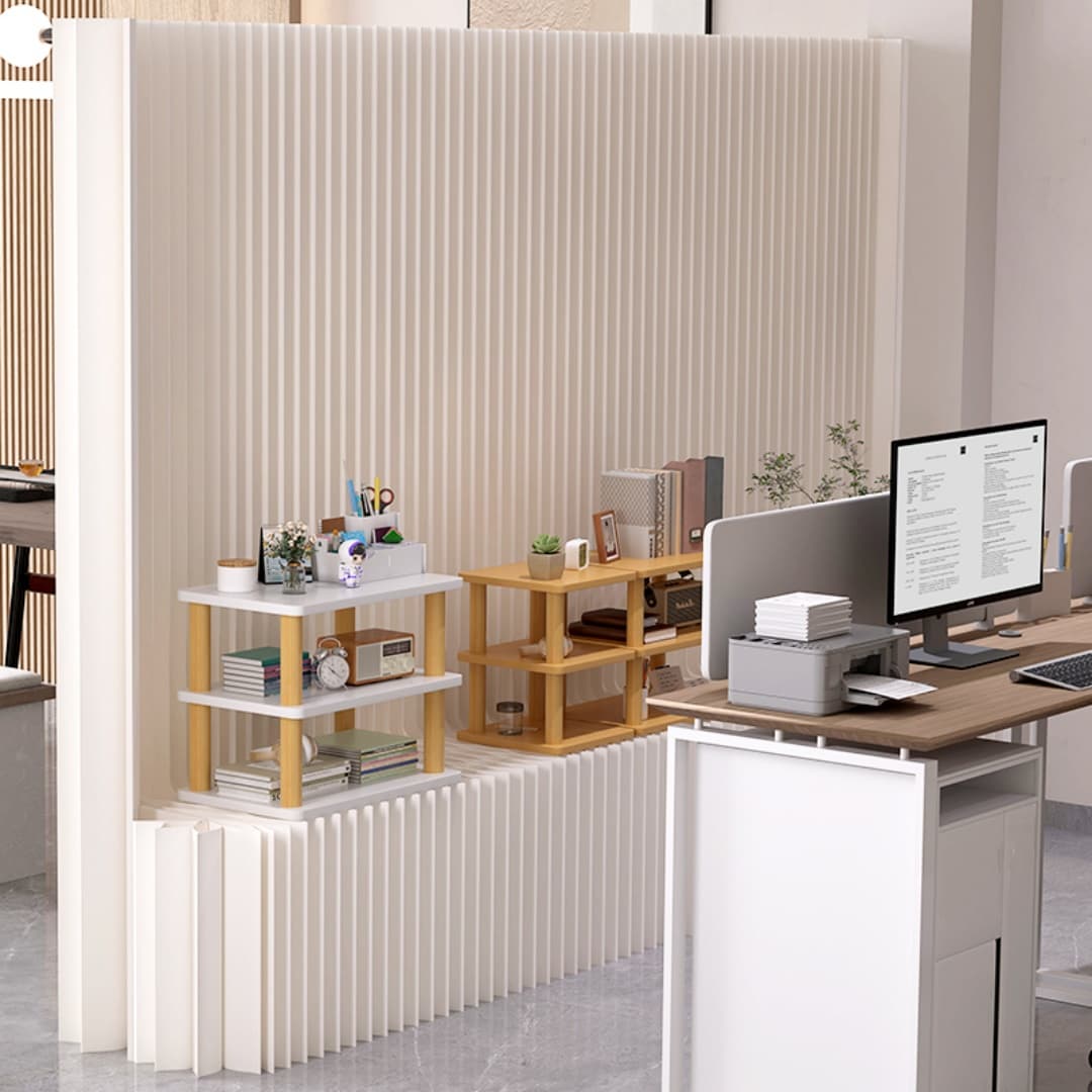 Paper display wall dividing desks in an open-plan office